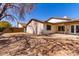 Backyard view showcasing the back exterior of the home and a yard at 4041 W Cielo Grande --, Glendale, AZ 85310