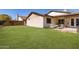 Lush backyard with a well-maintained lawn and a covered patio at 4041 W Cielo Grande --, Glendale, AZ 85310