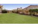 Serene backyard featuring a lush green lawn, providing a perfect outdoor living space at 4041 W Cielo Grande --, Glendale, AZ 85310
