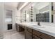 Large bathroom featuring double sinks, bright lighting, and tiled floors and countertops at 4041 W Cielo Grande --, Glendale, AZ 85310