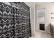 Bathroom with shower featuring decorative shower curtain and a small window at 4041 W Cielo Grande --, Glendale, AZ 85310