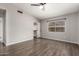 Bedroom with neutral paint, hardwood floors, ceiling fan, and view of walk-in closet at 4041 W Cielo Grande --, Glendale, AZ 85310