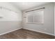 Bedroom featuring hardwood floors, two-tone neutral paint, a shelf, and a window at 4041 W Cielo Grande --, Glendale, AZ 85310