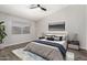 Serene bedroom with natural light, neutral decor, and sleek ceiling fan at 4041 W Cielo Grande --, Glendale, AZ 85310