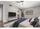 Vaulted bedroom with a ceiling fan, walk-in closet, and view of the backyard at 4041 W Cielo Grande --, Glendale, AZ 85310