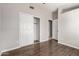 Bedroom with hardwood floors, closet, and neutral paint color scheme at 4041 W Cielo Grande --, Glendale, AZ 85310