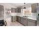 Cozy kitchen with stainless steel appliances, light grey cabinetry, and tile flooring at 4041 W Cielo Grande --, Glendale, AZ 85310