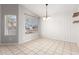 Bright and airy dining room boasts tile flooring and updated light fixtures at 4041 W Cielo Grande --, Glendale, AZ 85310