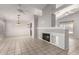 Spacious living room featuring tile flooring, vaulted ceilings, with fireplace and neutral color palette at 4041 W Cielo Grande --, Glendale, AZ 85310