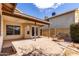 Covered patio with outdoor lighting, access to backyard, and a brick firepit at 4041 W Cielo Grande --, Glendale, AZ 85310