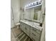 Bright bathroom with granite vanity, updated fixtures, and tile floors at 4210 E Rosemonte Dr, Phoenix, AZ 85050