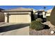 Charming single-story home featuring a two-car garage and manicured landscaping at 4210 E Rosemonte Dr, Phoenix, AZ 85050