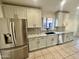 Kitchen with stainless steel appliances, granite countertops, and white cabinets and hardware at 4210 E Rosemonte Dr, Phoenix, AZ 85050