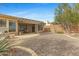 Spacious backyard with gravel, patio area, desert landscaping, and mountain views at 42123 N Long Cove Way, Anthem, AZ 85086