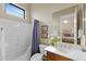 Bathroom featuring a shower/tub combination and a vanity with an elegant mirror at 42123 N Long Cove Way, Anthem, AZ 85086