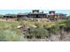 Expansive clubhouse with desert landscaping and golf course in the foreground at 42123 N Long Cove Way, Anthem, AZ 85086