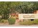 Elegant Anthem Golf & Country Club entrance sign surrounded by vibrant flowers and lush greenery at 42123 N Long Cove Way, Anthem, AZ 85086