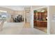 Hallway leading to a dining room and office space featuring hardwood floors and neutral tones at 42123 N Long Cove Way, Anthem, AZ 85086