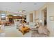 Open-concept living room flowing into a well-appointed kitchen and dining area at 42123 N Long Cove Way, Anthem, AZ 85086