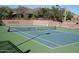 Clean blue and green community tennis court with desert views at 42123 N Long Cove Way, Anthem, AZ 85086