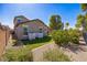 Well-maintained backyard with lush green lawn, mature trees, and an inviting outdoor space at 42256 W Lucera Ln, Maricopa, AZ 85138