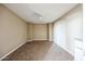 Spacious carpeted bedroom featuring a ceiling fan, neutral paint, and ample natural light at 42256 W Lucera Ln, Maricopa, AZ 85138