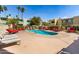 Community pool featuring ample lounging space and well-maintained landscaping in a serene setting at 4610 N 68Th St # 472, Scottsdale, AZ 85251