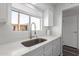 Bright kitchen with quartz countertop, stainless steel sink, modern faucet, and a window providing natural light at 4610 N 68Th St # 472, Scottsdale, AZ 85251