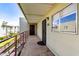 Outdoor porch with secured doorway and exterior views, offering privacy and security at 4610 N 68Th St # 472, Scottsdale, AZ 85251