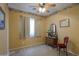 Bedroom with neutral carpet, ceiling fan, and traditional furnishings at 46175 W Morning View Ln, Maricopa, AZ 85139