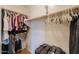 Walk-in closet featuring ample hanging space, shelving, and room for storage at 46175 W Morning View Ln, Maricopa, AZ 85139