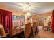 Formal dining room with tile flooring, traditional furniture, china cabinet, and chandelier at 46175 W Morning View Ln, Maricopa, AZ 85139