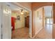 Inviting living room with neutral walls and tile floors, and featuring a large built-in hutch at 46175 W Morning View Ln, Maricopa, AZ 85139