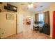 Light filled home office featuring a desk, a window, and tile flooring at 46175 W Morning View Ln, Maricopa, AZ 85139