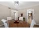 Dining room features a round table and wood floors, with views to other rooms in the home at 4619 E Farmdale Ave, Mesa, AZ 85206