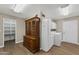 Large laundry room featuring a washer, dryer, storage cabinets, and a china cabinet with tile flooring at 4619 E Farmdale Ave, Mesa, AZ 85206