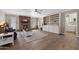 Spacious living room features a brick fireplace, ceiling fan, and custom built-in shelving with tile flooring at 4619 E Farmdale Ave, Mesa, AZ 85206