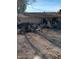 Backyard with a variety of household items, junk, and clutter at 510 N Bass Rd, Wickenburg, AZ 85390