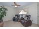 Bonus room with neutral decor, large window, a ceiling fan, and comfortable seating at 5223 W Acoma Dr, Glendale, AZ 85306