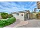 Backyard shed with solar panels and quirky sun decoration at 5223 W Acoma Dr, Glendale, AZ 85306