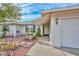 Welcoming front entrance with charming fountain, stone walkway, and well-maintained garden at 5223 W Acoma Dr, Glendale, AZ 85306