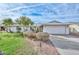 Charming single-level home with well-manicured lawn, mature landscaping, and a spacious two-car garage at 5223 W Acoma Dr, Glendale, AZ 85306