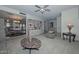 Spacious living room with a built-in bookshelf and view to the dining room at 5223 W Acoma Dr, Glendale, AZ 85306