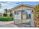 Enclosed patio with sliding glass doors featuring palm trees and greenery at 5223 W Acoma Dr, Glendale, AZ 85306