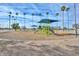 Community park featuring a playground with a shade structure and mature palm trees at 5223 W Acoma Dr, Glendale, AZ 85306