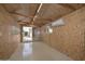 This is an interior view of a shed with a plywood walls and ceiling, a mini split and sliding doors at 5223 W Acoma Dr, Glendale, AZ 85306