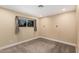 Neutral bedroom offering a tranquil atmosphere with carpet floors and natural light from the window at 6036 E Windsor Ave, Scottsdale, AZ 85257