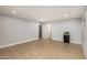 Expansive living area with tile flooring, neutral paint, and recessed lights at 6036 E Windsor Ave, Scottsdale, AZ 85257