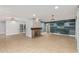 Spacious living room featuring tile flooring, a fireplace, stylish lighting, and an open layout at 6036 E Windsor Ave, Scottsdale, AZ 85257