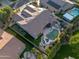 Aerial view showcasing pool, putting green, covered patio, and lush backyard at 686 E Vermont Dr, Gilbert, AZ 85295